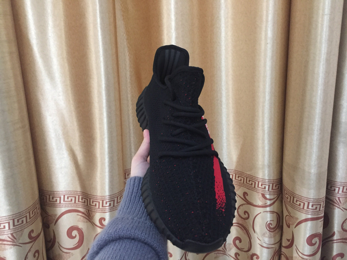 Yeezy 350 V2 Sneakers in Black and Red Knit - product image from the listing.