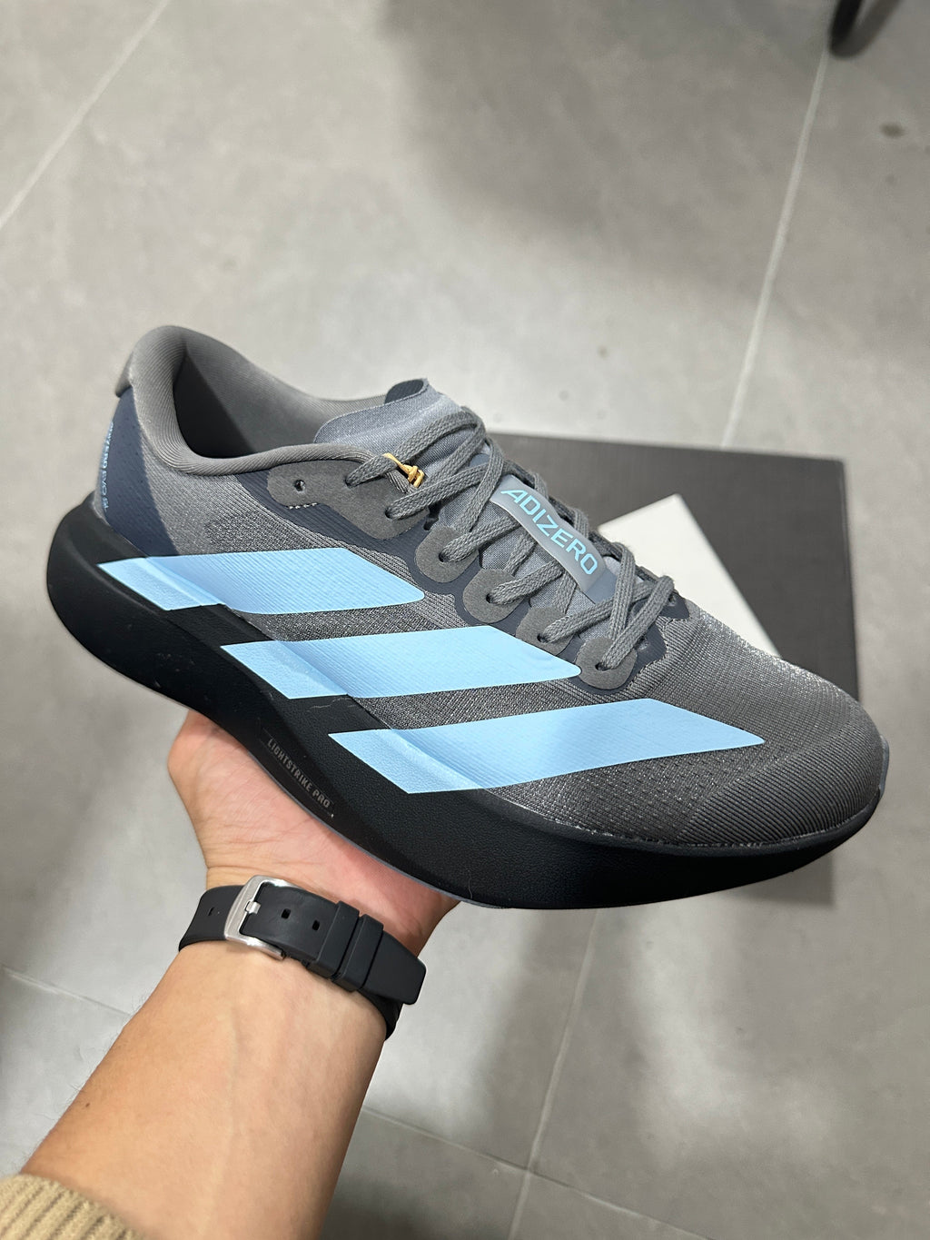Grey and Blue Adizero Lightstrike Pro Running Shoes - product image from the listing.