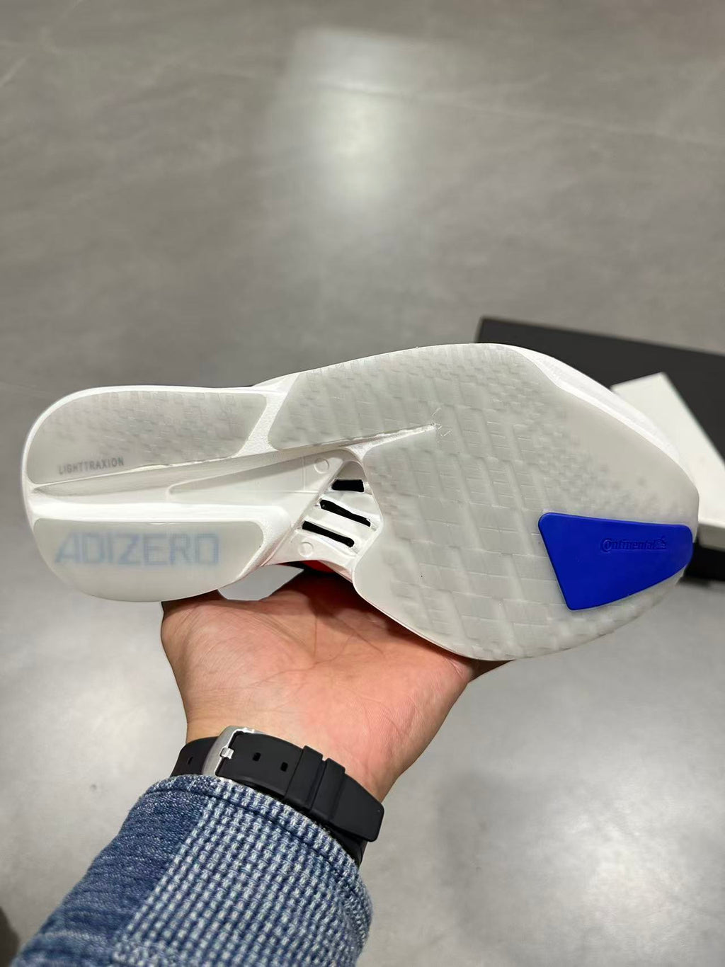 Nike Adizero Lightstrike Pro Running Shoes, in Navy and Orange - product image from the listing.