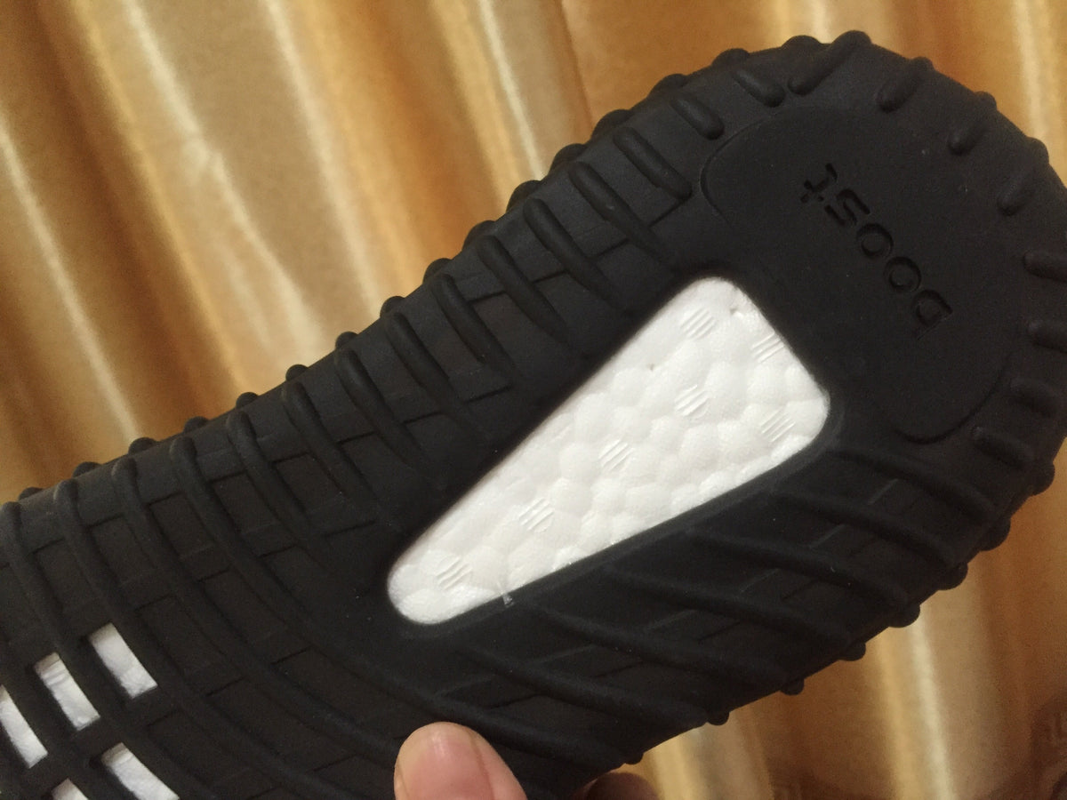 Adidas Yeezy Boost 350 V2 Sneakers in Black Knit - product image from the listing.