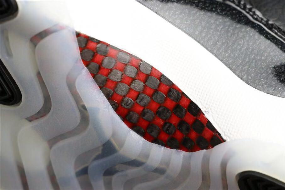 Air Jordan 11 Retro 72-10 High-Top Sneakers in Black and White - product image from the listing.