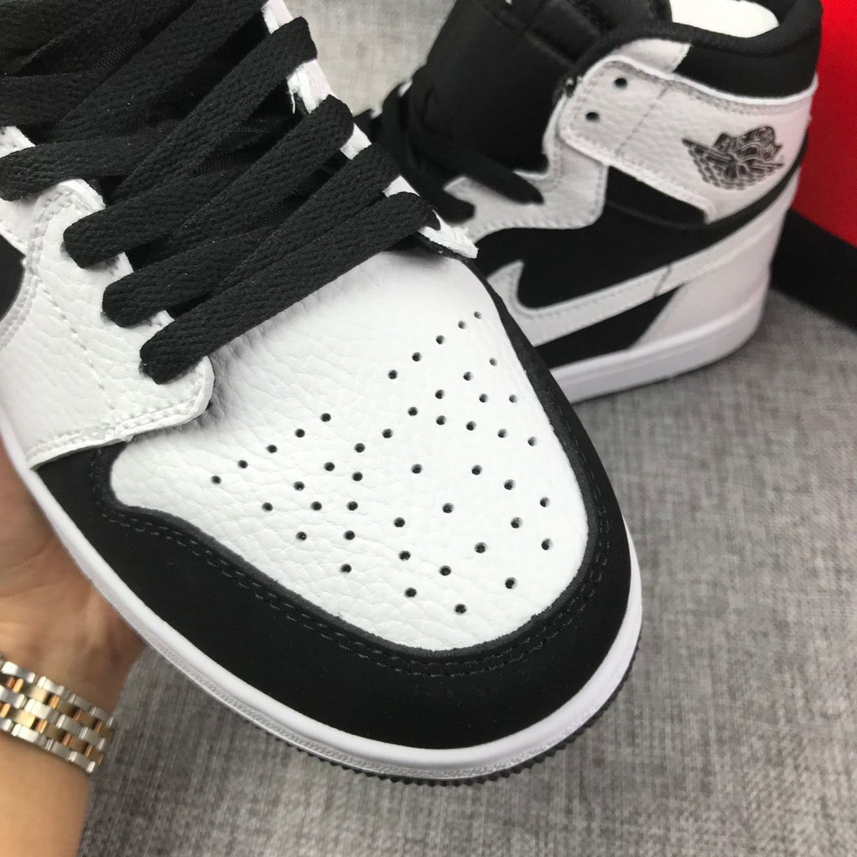 Air Jordan 1 High Sneakers in Black and White 554724-113 - product image from the listing.