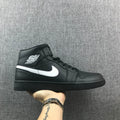 Air Jordan 1 Mid Sneakers in Black White 554724-049 - product image from the listing.