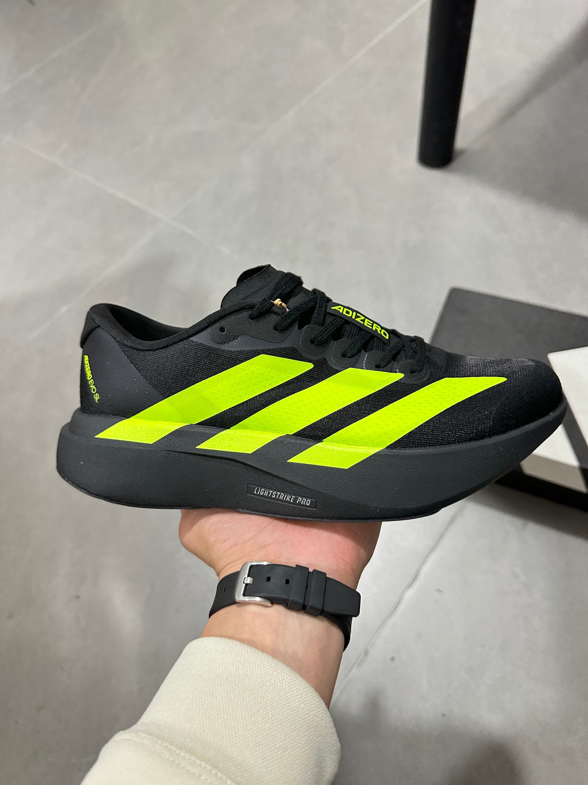 Adidas Adizero Running Shoes in Black and Volt Green JS3420 - product image from the listing.