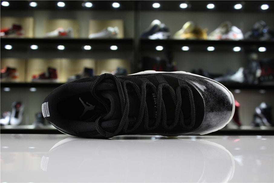 Jordan 11 Retro Low Barons Sneakers in Black White - product image from the listing.