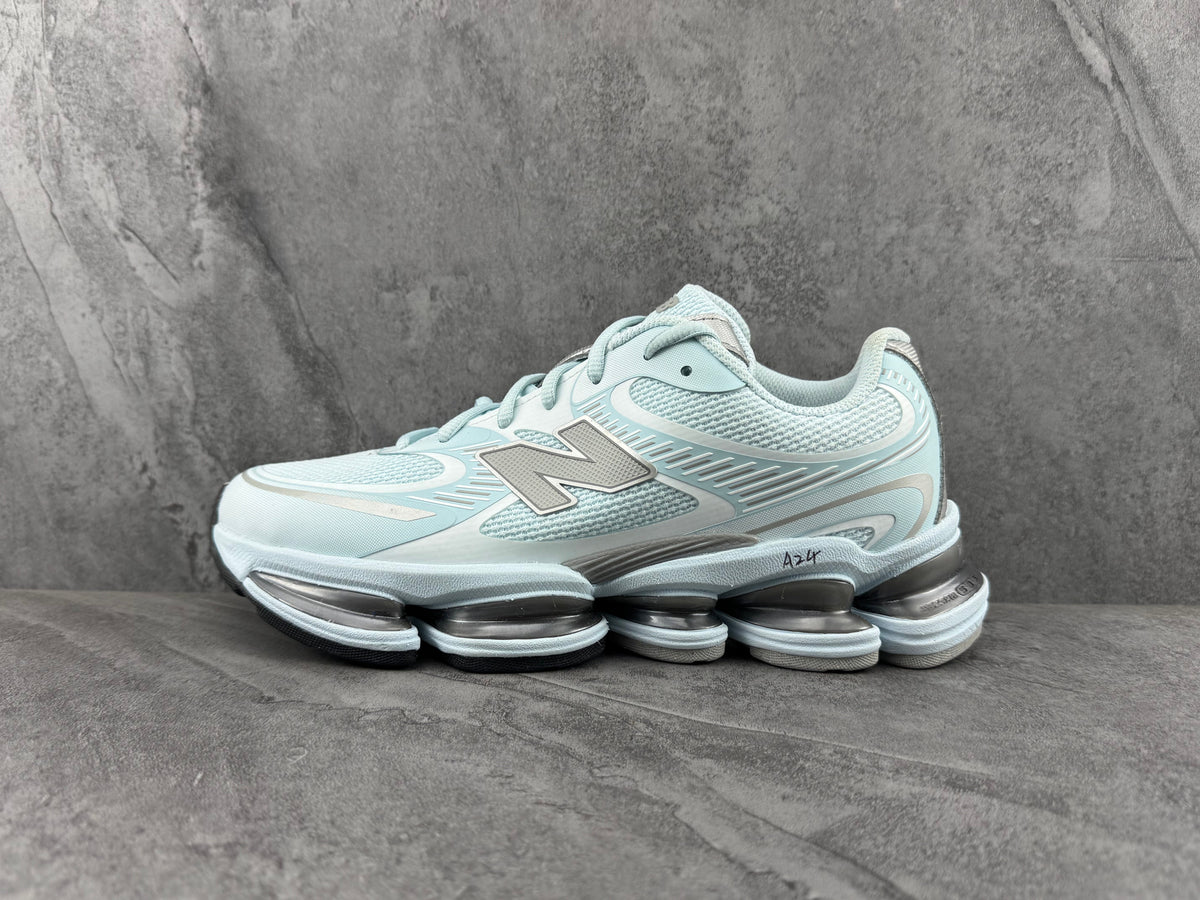 Pale Blue and Silver New Balance 1906R Sneakers - product image from the listing.