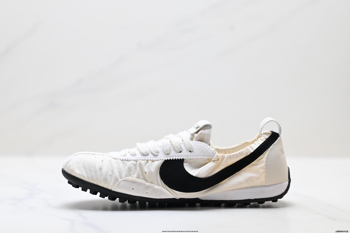 Jacquemus x Nike Jacumoon Low-Top Sneakers, in White and Black - product image from the listing.