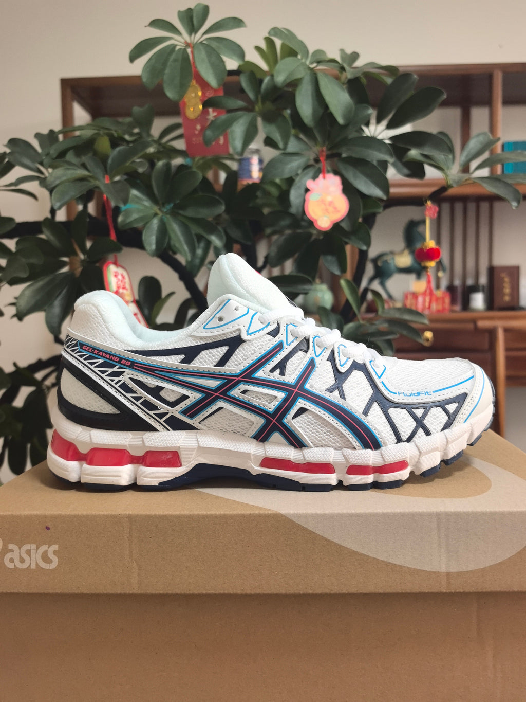 ASICS GEL-KAYANO 20 Running Sneakers in White and Blue - product image from the listing.