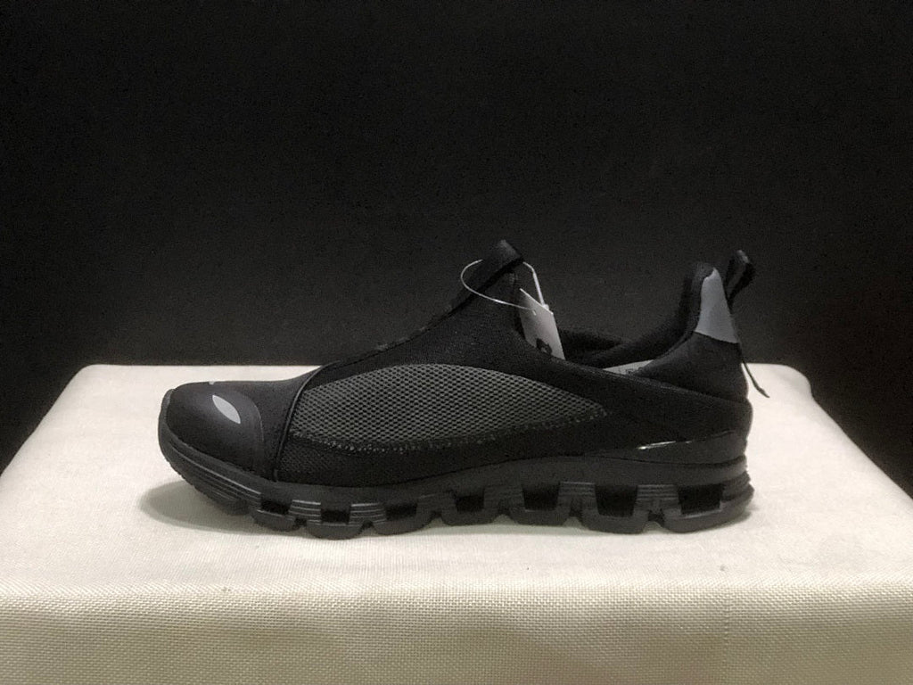 On Cloud 4 Coast Black Slip-On Trainers - product image from the listing.