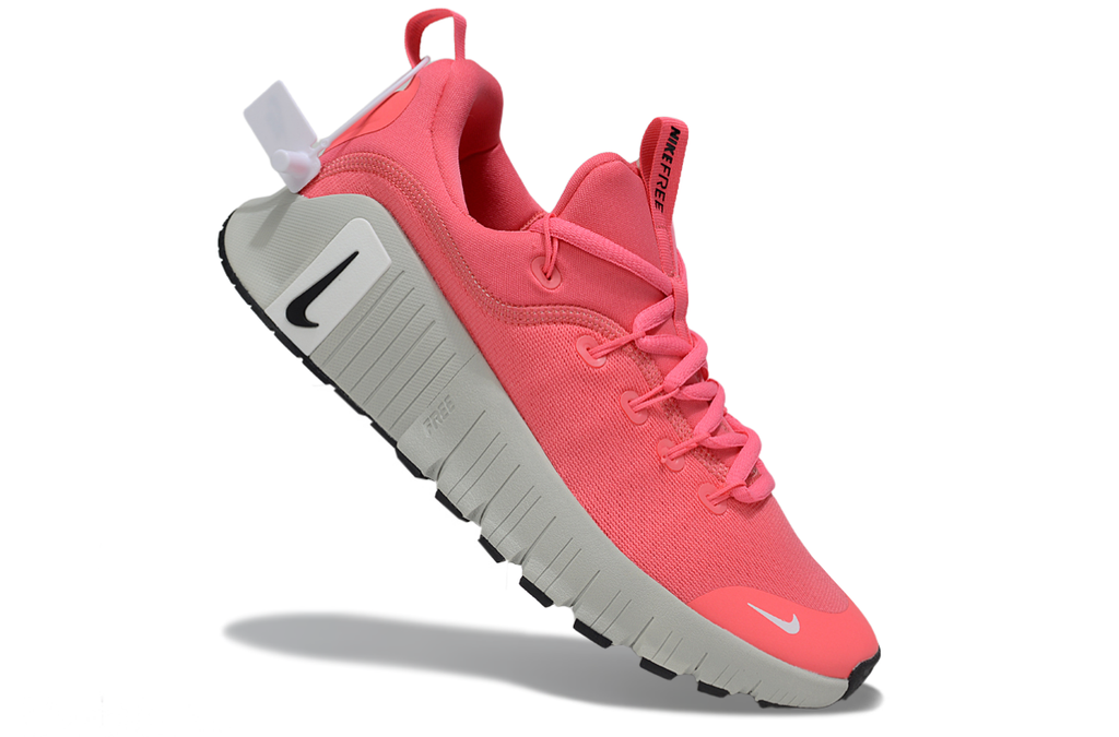 Coral Pink and Gray Nike Free Metcon 5 Sneakers - product image from the listing.