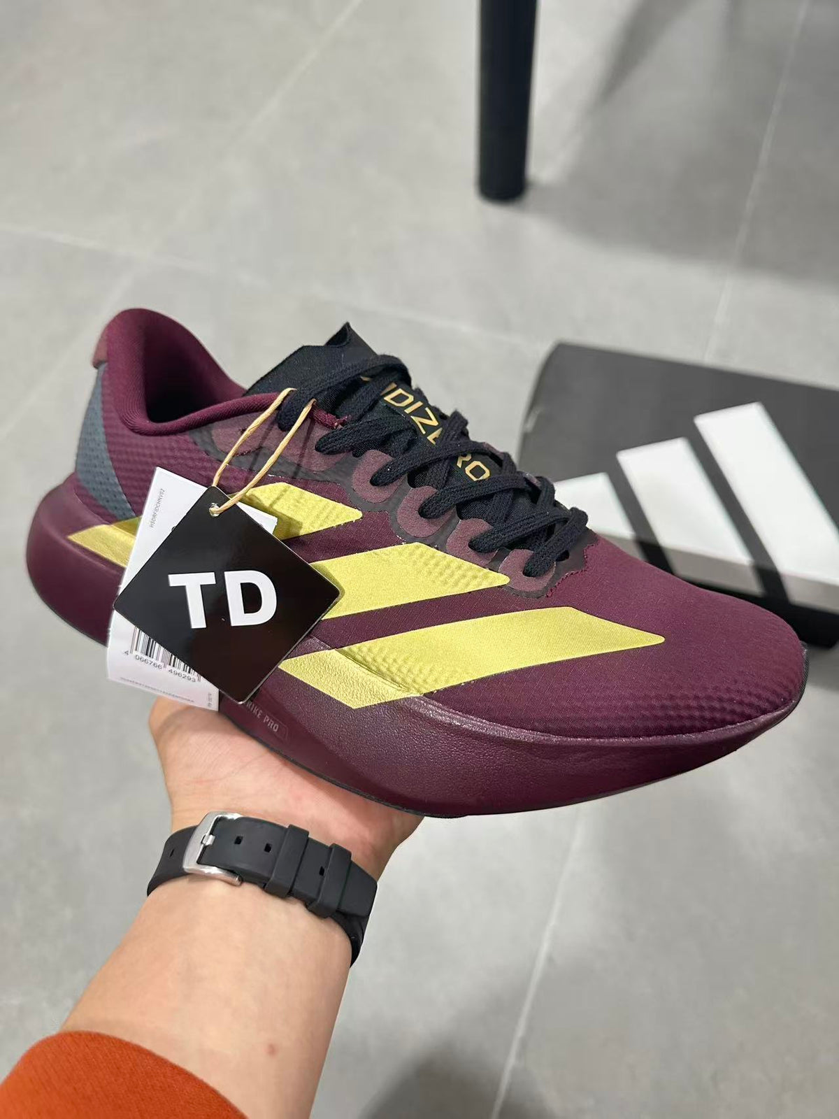 Adidas Lightstrike Pro Running Shoes in Burgundy Gold JQ4443 - product image from the listing.