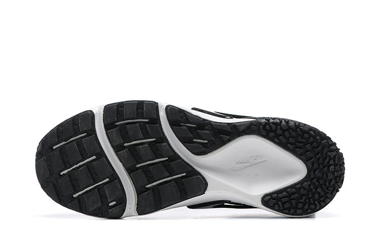 Nike Air Huarache Sneakers in Black and White - product image from the listing.