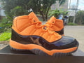 "Black/Orange" Air Jordan 11 Retro Sneaker - product image from the listing.