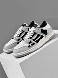AMIRI Gray and White Low-Cut Sneakers with Black Accents - product image from the listing.