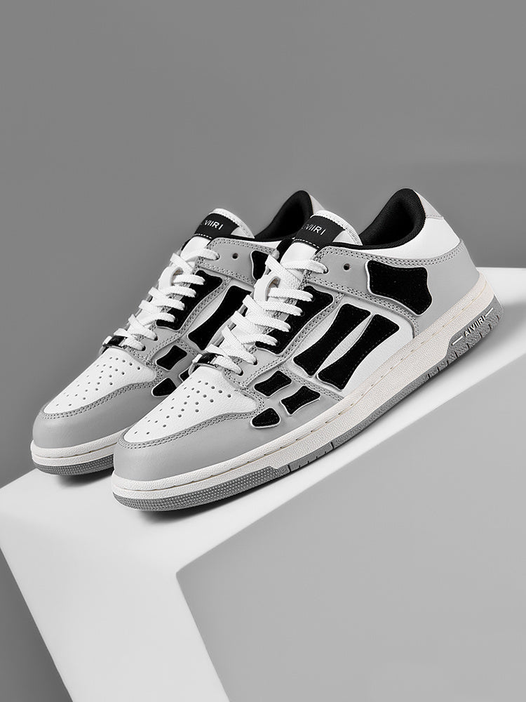 AMIRI Gray and White Low-Cut Sneakers with Black Accents - product image from the listing.