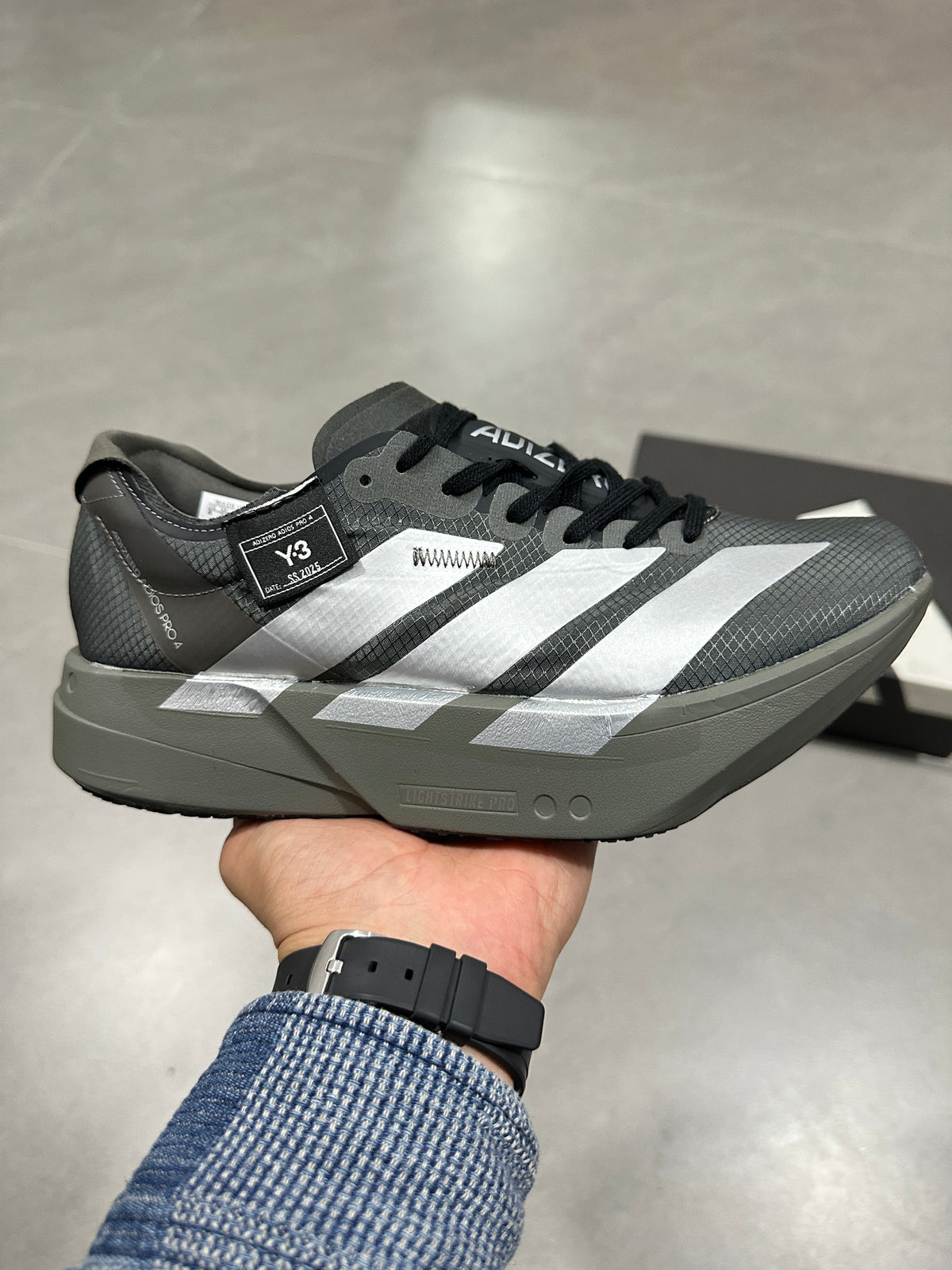 Adidas Adizero Adios Pro 4 Running Shoes in Grey Black - product image from the listing.