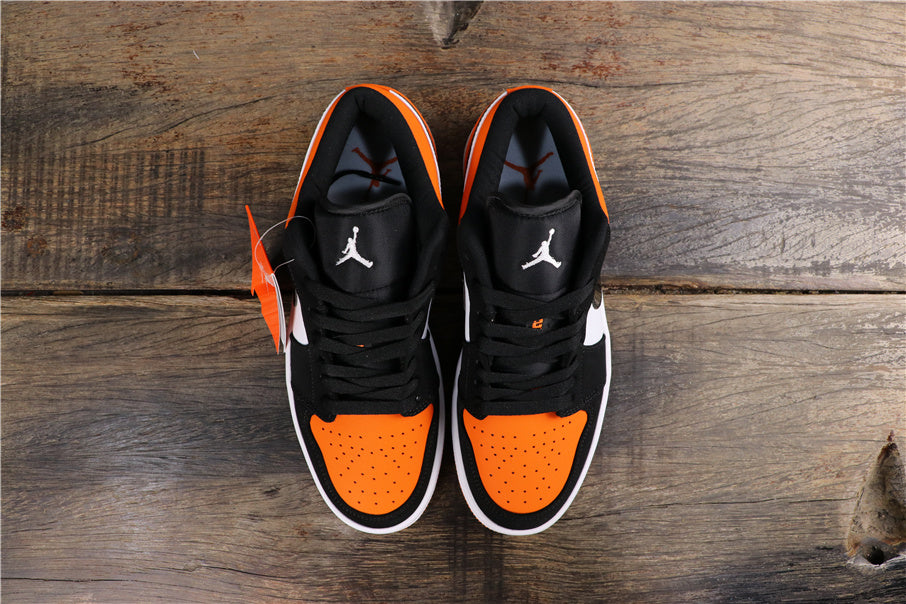 Air Jordan 1 Low Black White Orange Sneakers 553558-128 - product image from the listing.