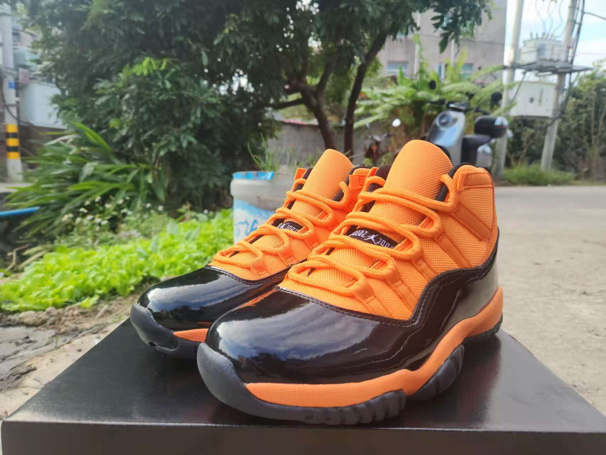 "Black/Orange" Air Jordan 11 Retro Sneaker - product image from the listing.