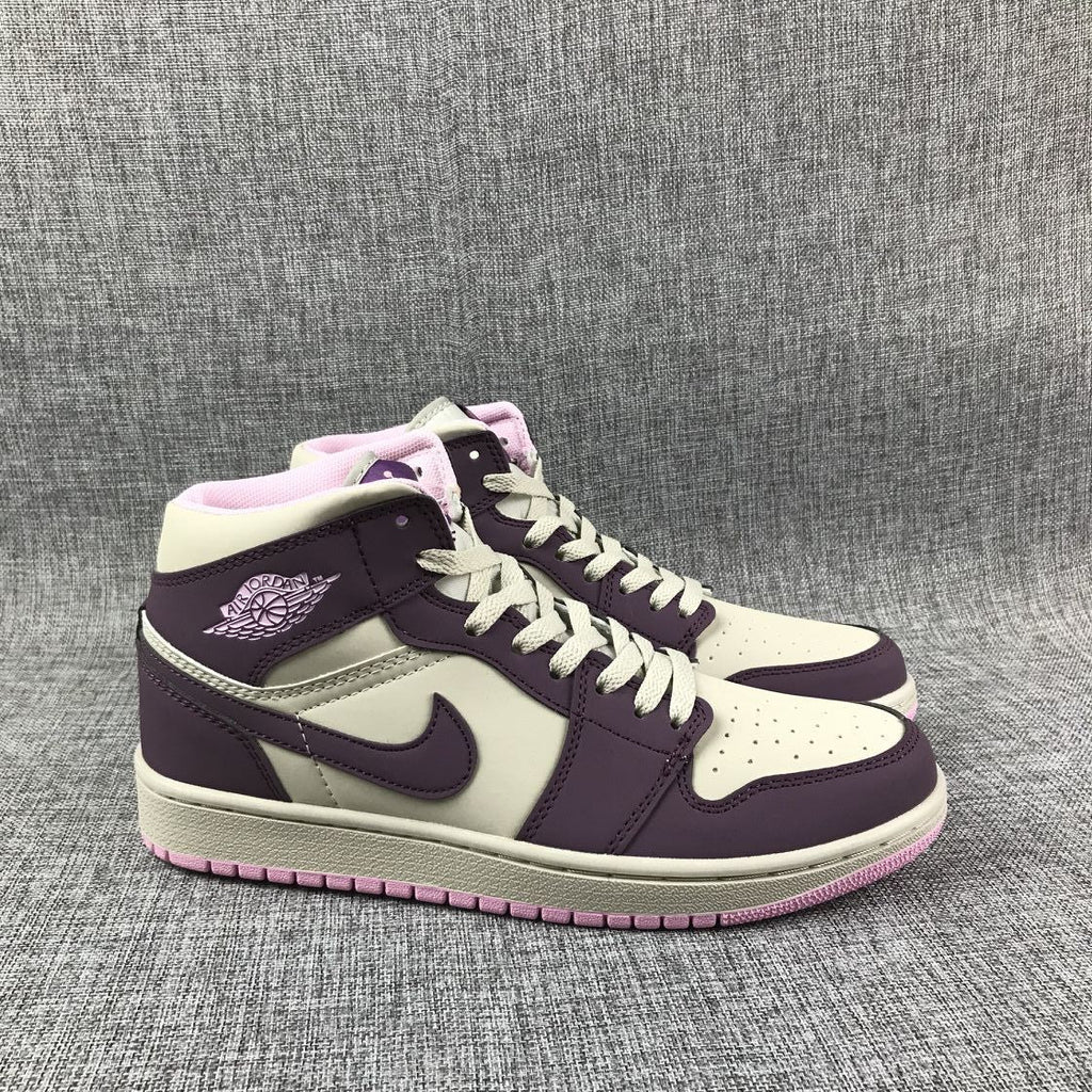 Air Jordan 1 Mid Sneakers in Pink Purple 555112-500 - product image from the listing.