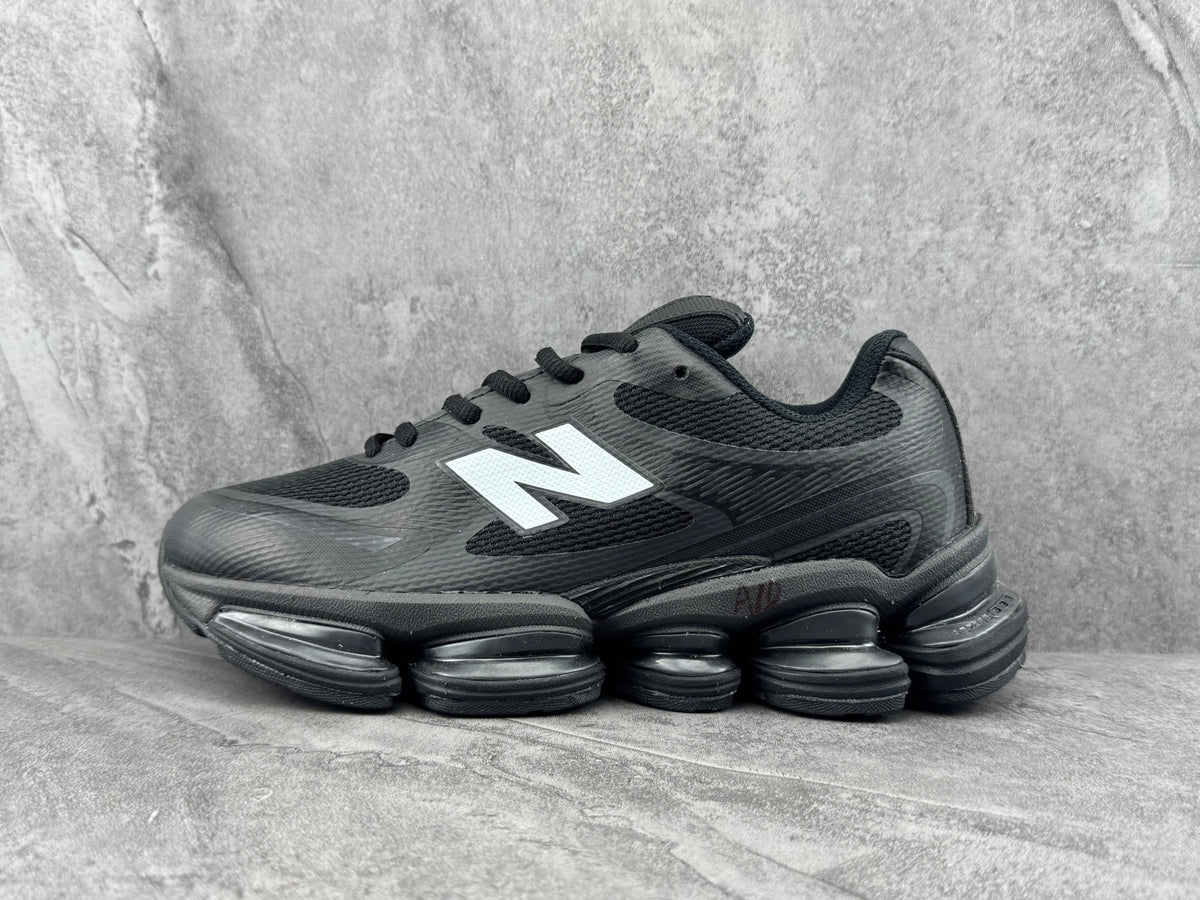 New Balance Black Trainers with White Logo - product image from the listing.
