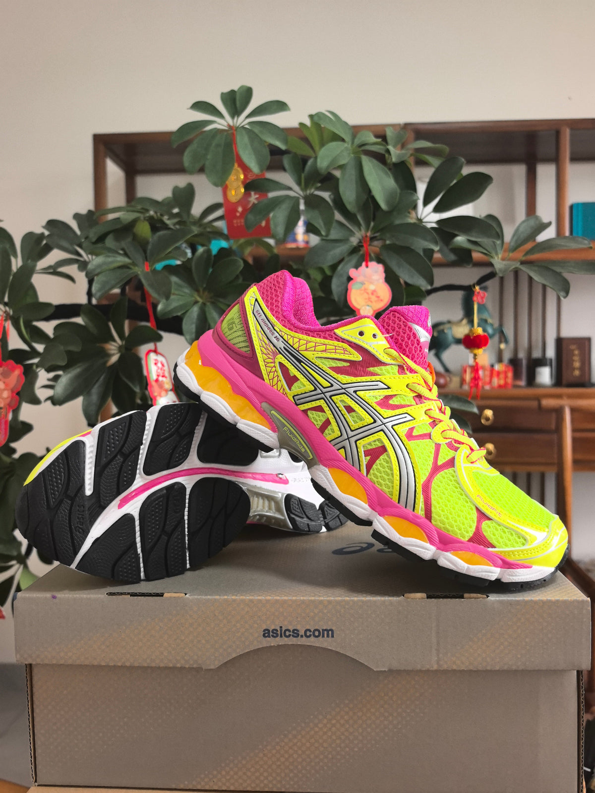 Pink and Lime ASICS GEL-Nimbus 16 Sneakers - product image from the listing.