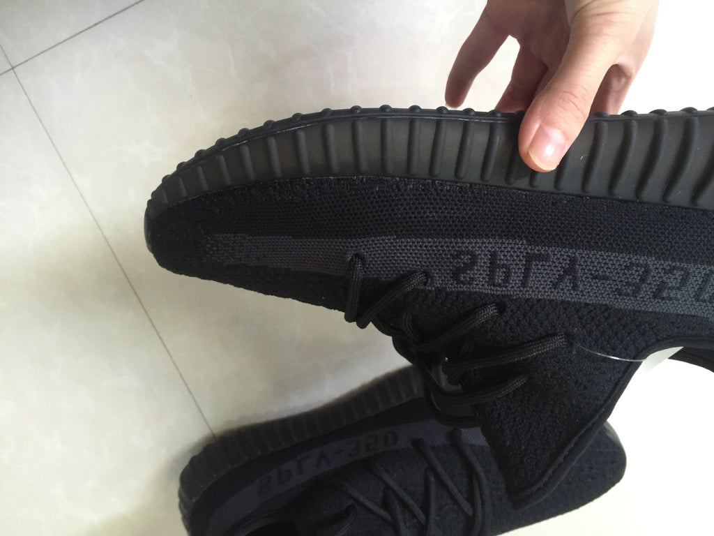Adidas Yeezy Boost 350 V2 Sneakers in Black Knit - product image from the listing.