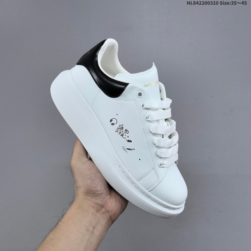 Alexander McQueen Oversized Low-Top Sneakers, in White and Black - product image from the listing.