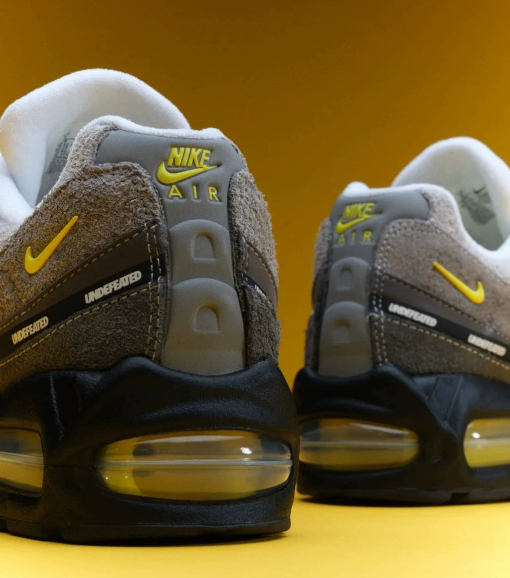 Nike Air Max 95 SP x UNDEFEATED Sneakers in Grey Yellow IB4523-002 - product image from the listing.