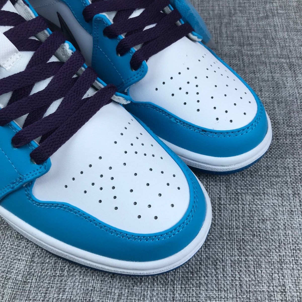 Air Jordan 1 Mid Sneakers in Blue, in White and Black - product image from the listing.
