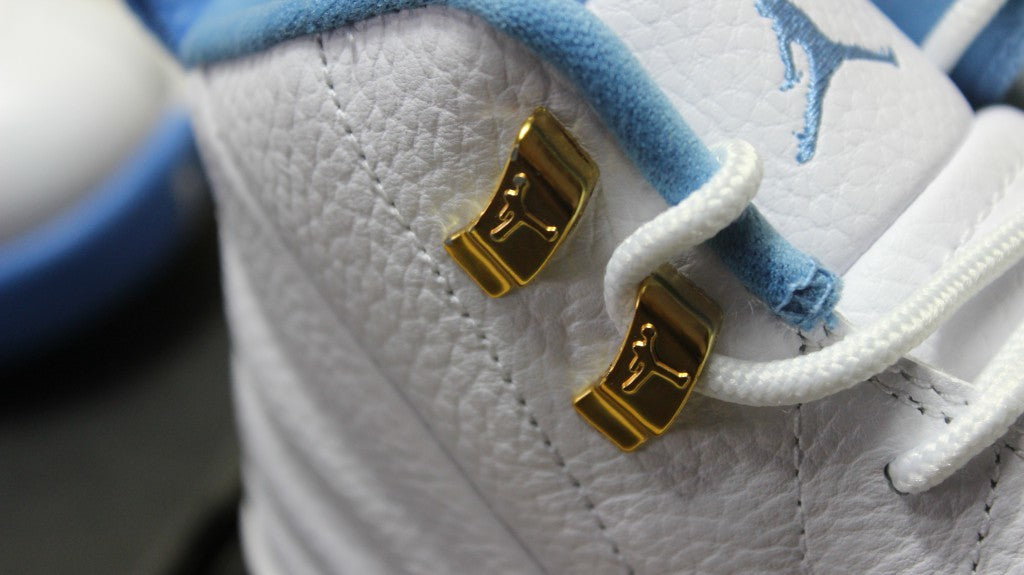 Air Jordan 12 High-Top Sneakers in University Blue 510815-127 - product image from the listing.