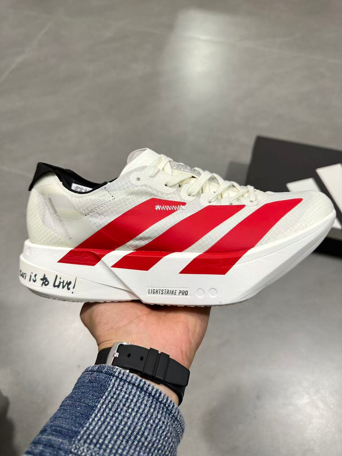 Nike Lightstrike Pro Running Sneakers in White and Red JR6363 - product image from the listing.