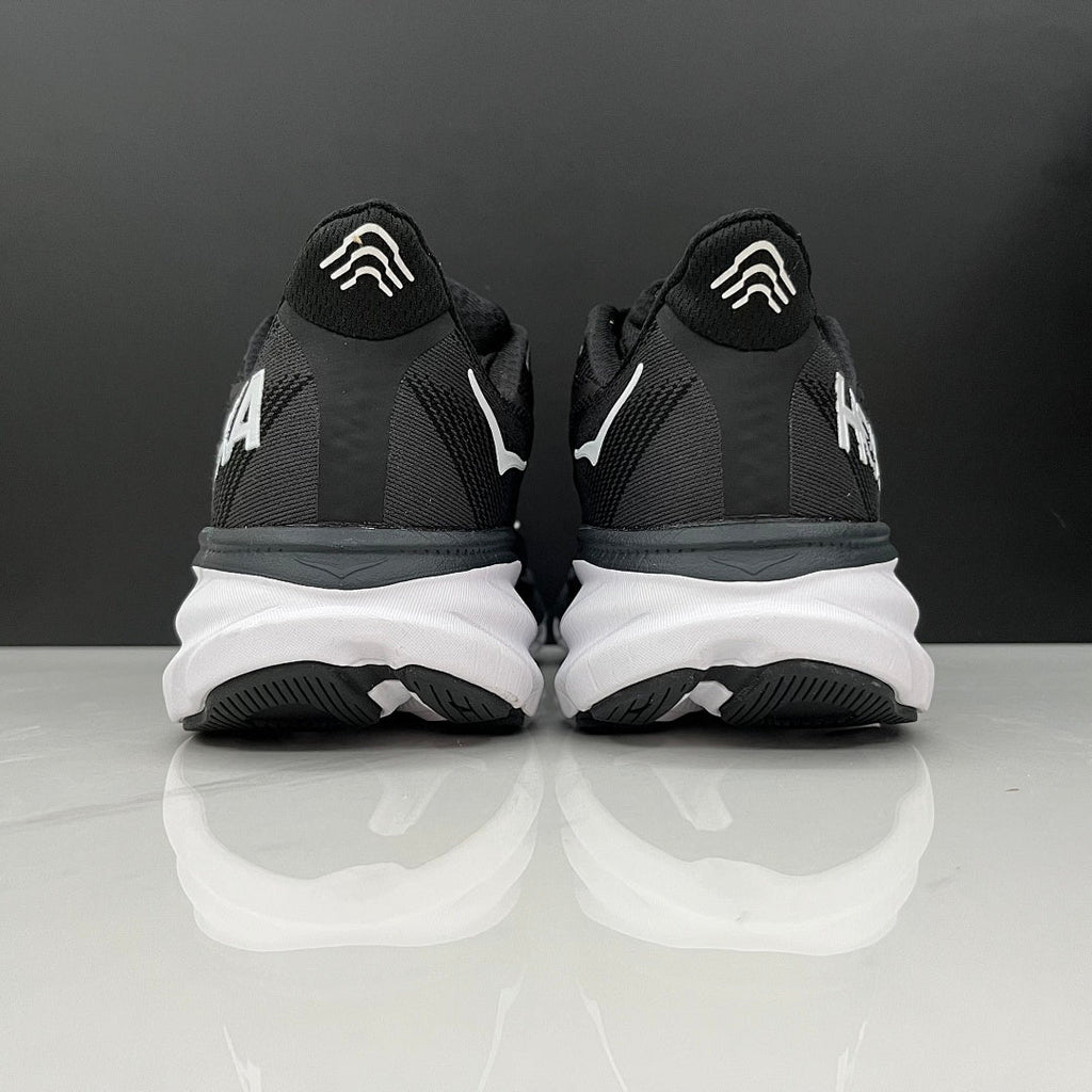 HOKA Clifton 9 Running Shoes in Black and White - product image from the listing.
