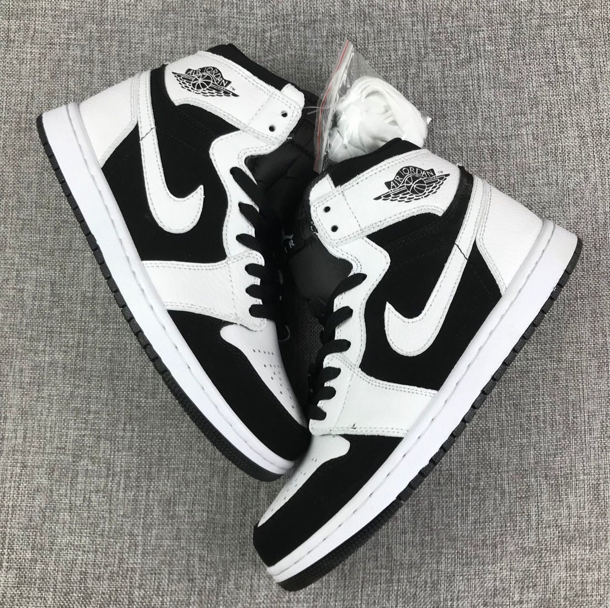 Air Jordan 1 High Sneakers in Black and White 554724-113 - product image from the listing.
