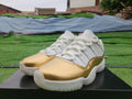 Air Jordan 11 Low in White/Gold - product image from the listing.
