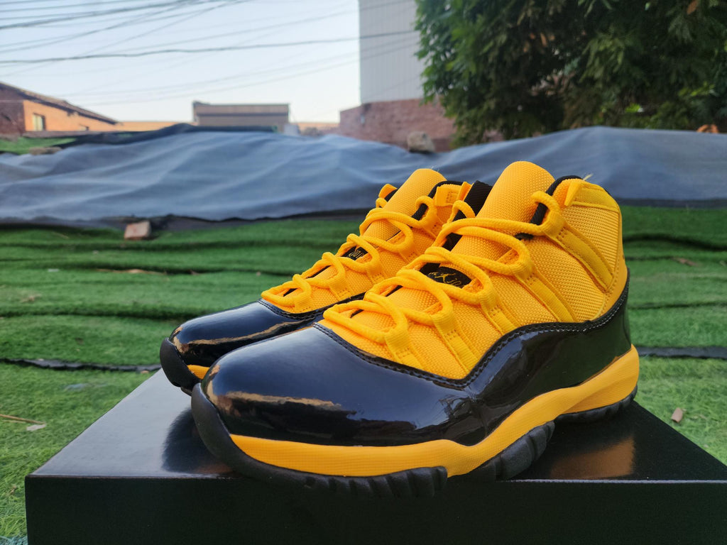 "Orange/Yellow/Black" Air Jordan 11 Retro - product image from the listing.