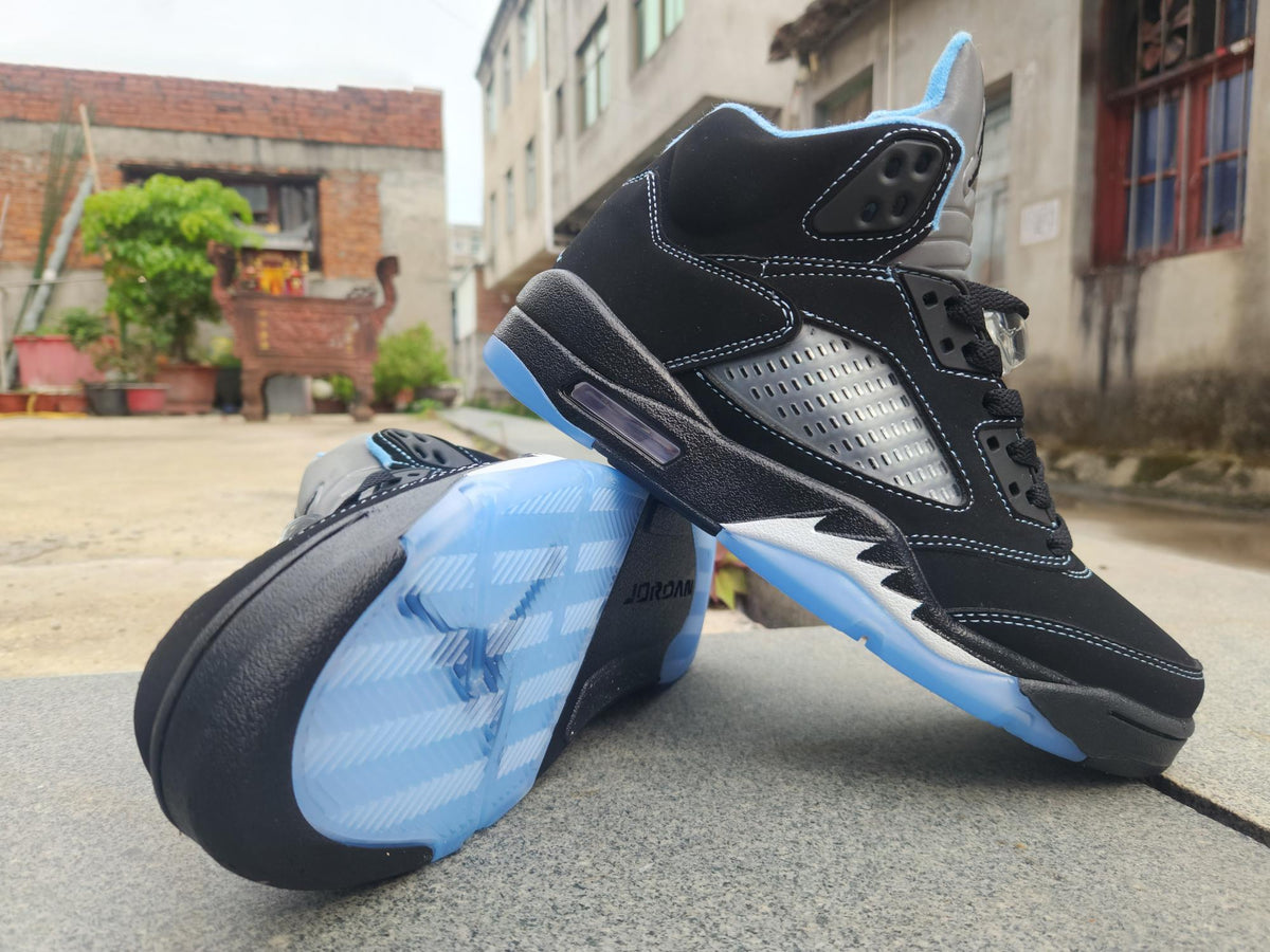 Air Jordan 5 in Black/University Blue - product image from the listing.