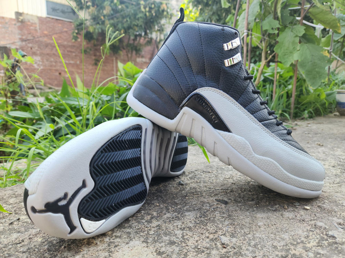 Air Jordan 12 Retro in Black/Light Grey - product image from the listing.