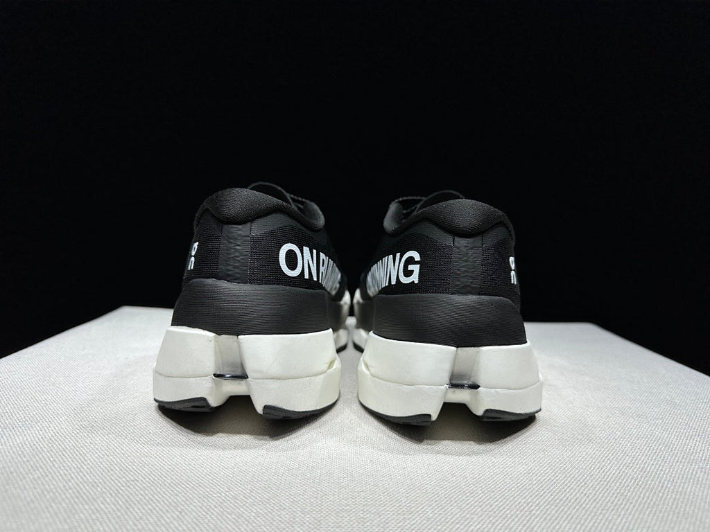 On Cloudboom Max Shoes for Running, Black/White - product image from the listing.