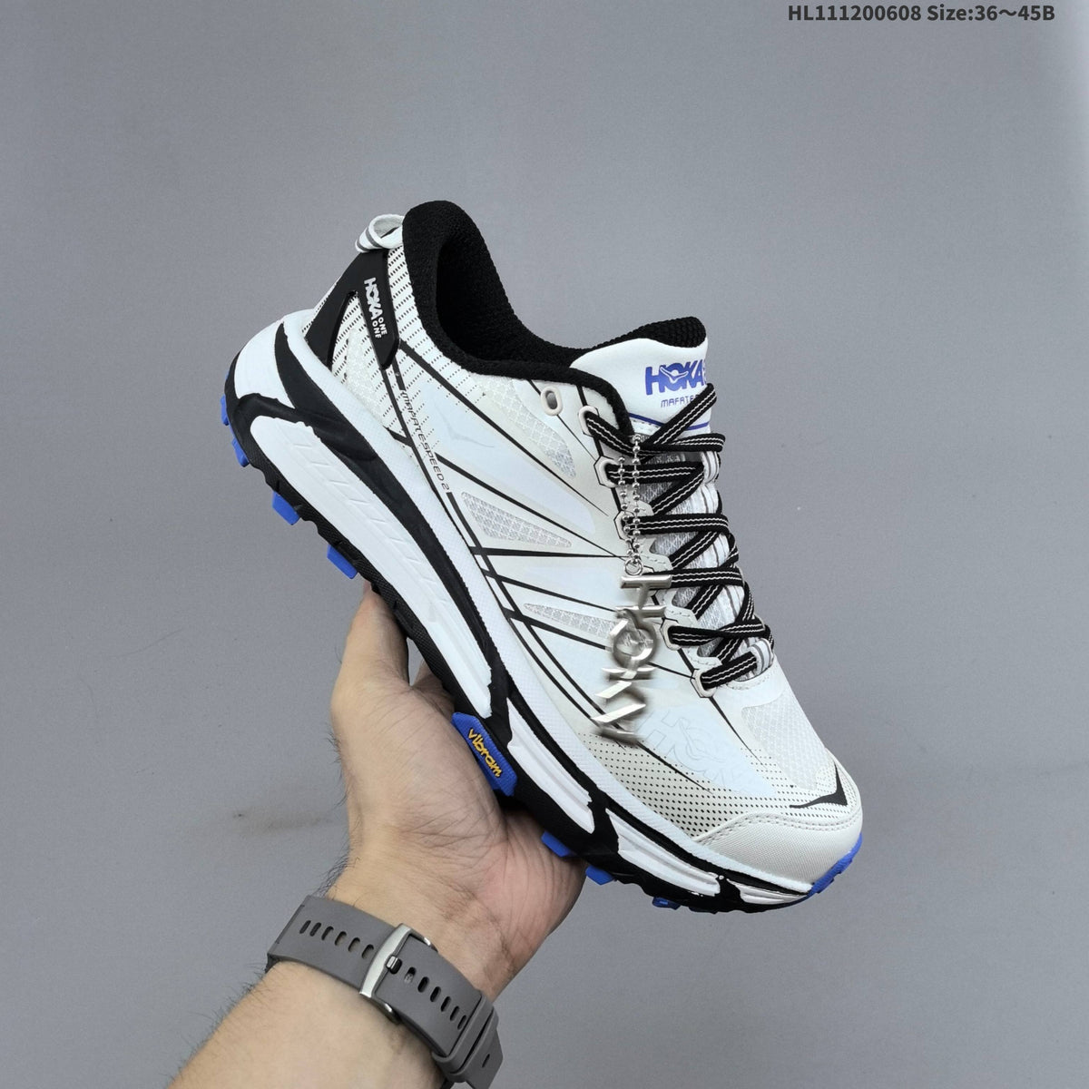 HOKA Mafate Speed 2 Low Trail Running Shoes, in White Black Blue - product image from the listing.