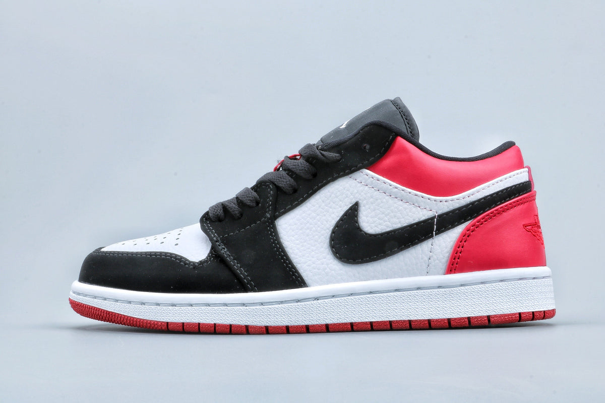 Jordan 1 Low Black Toe Sneakers in Black White Red - product image from the listing.