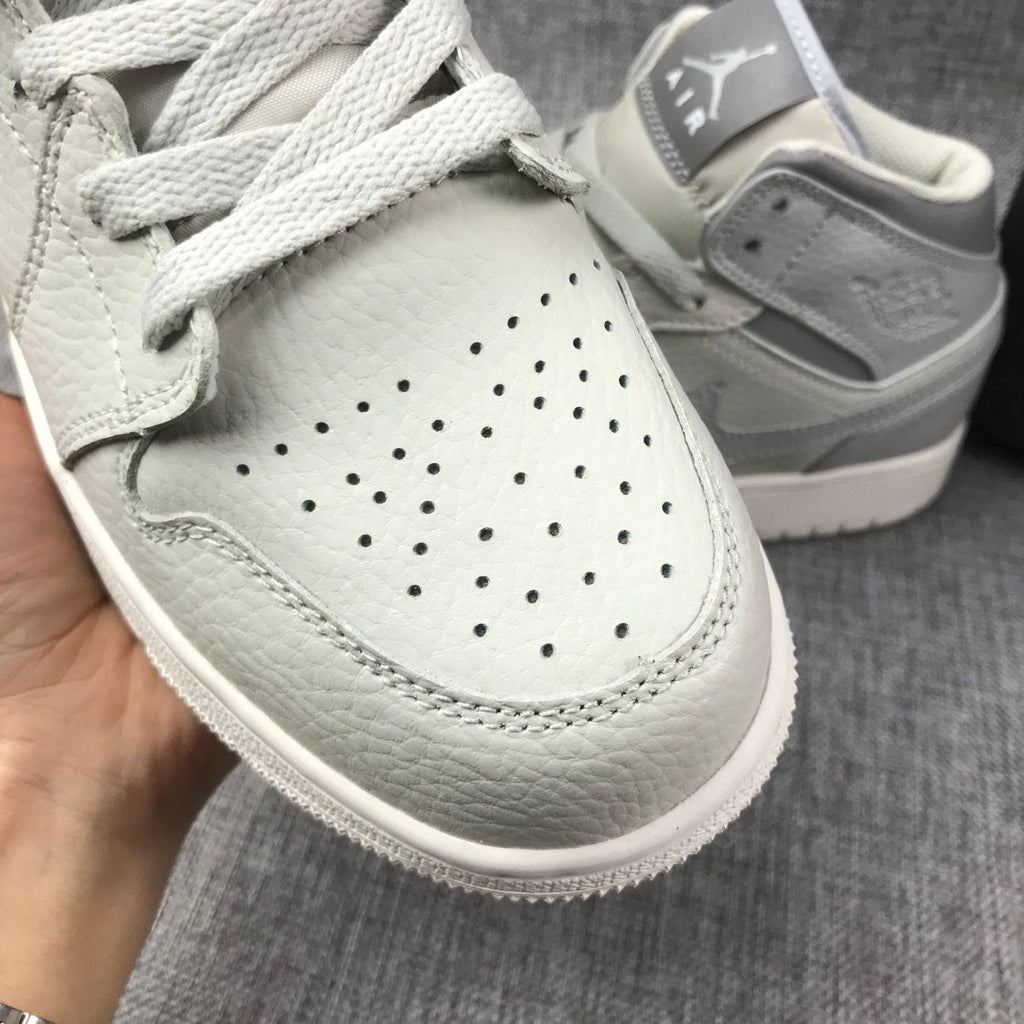 White and Grey Air Jordan 1 Mid Sneakers - product image from the listing.