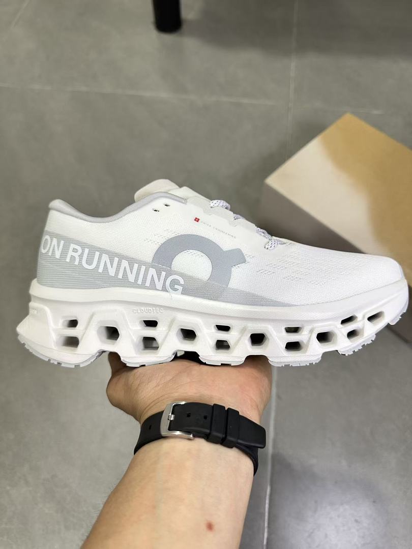 On Running Running Sneakers in White and Gray - product image from the listing.