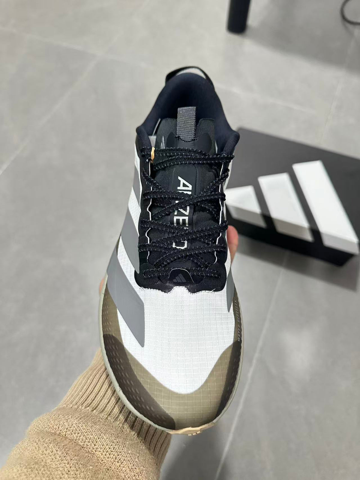 Black and White Adidas Adizero SL Running Shoes - product image from the listing.