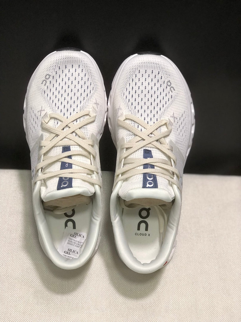 On Cloud X 4 Sneakers in Ivory and Blue - product image from the listing.