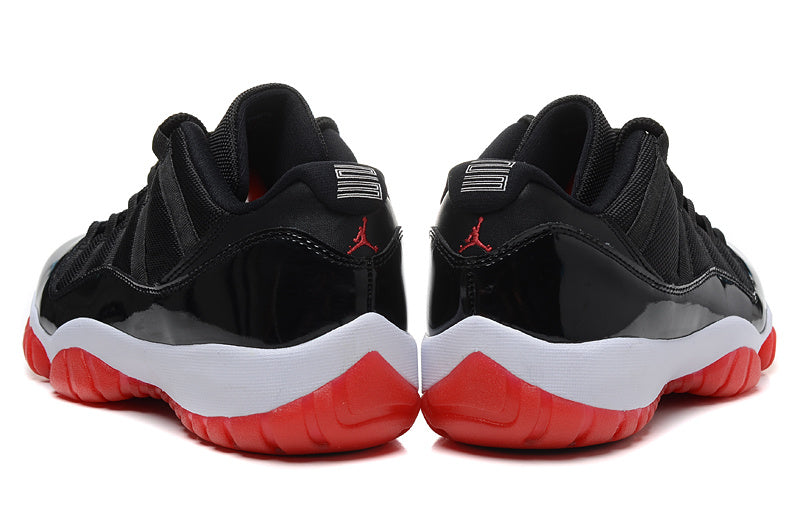 Air Jordan 11 Retro Low Black and Red Sneakers - product image from the listing.