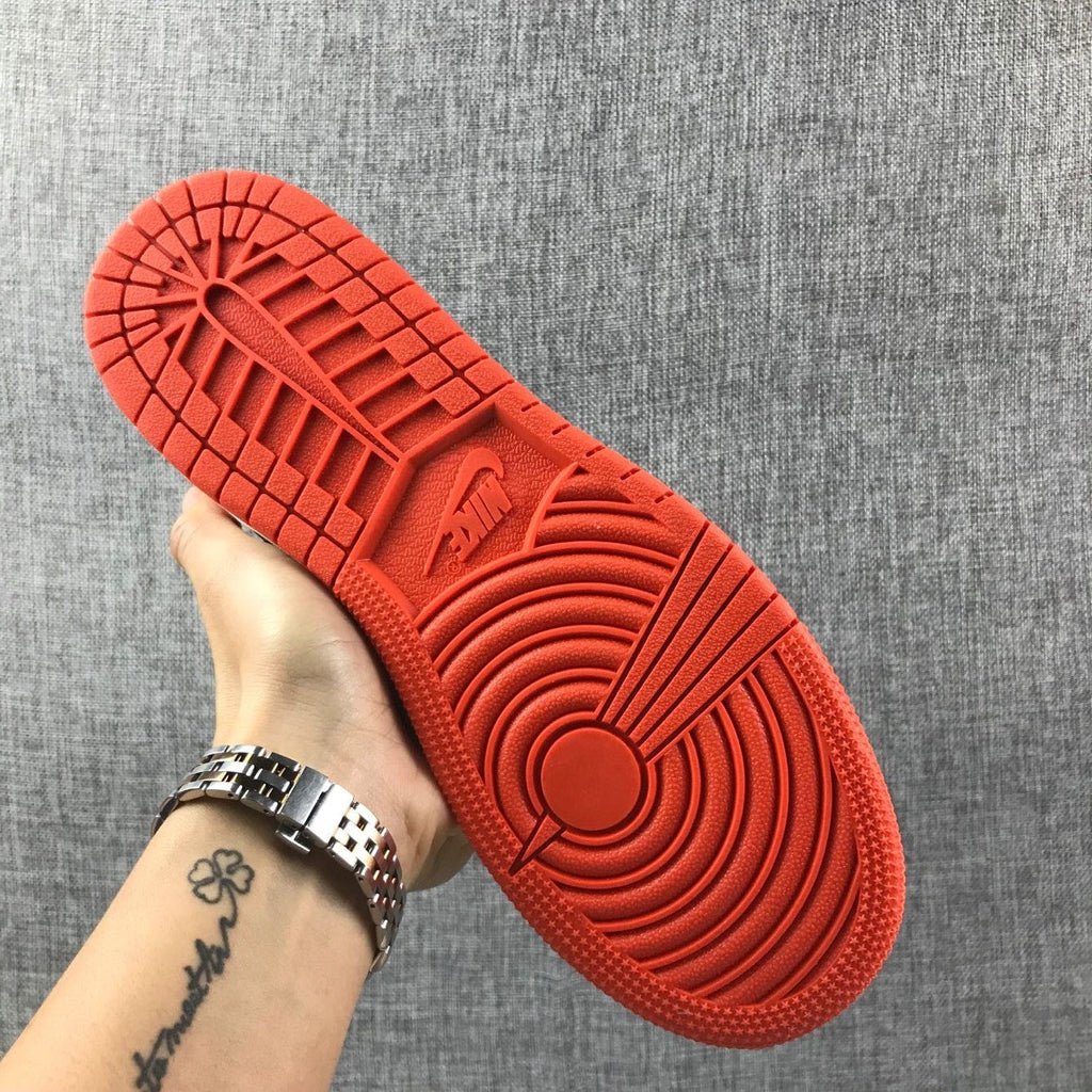 Air Jordan 1 Mid GS Sneakers in Pink and Orange - product image from the listing.