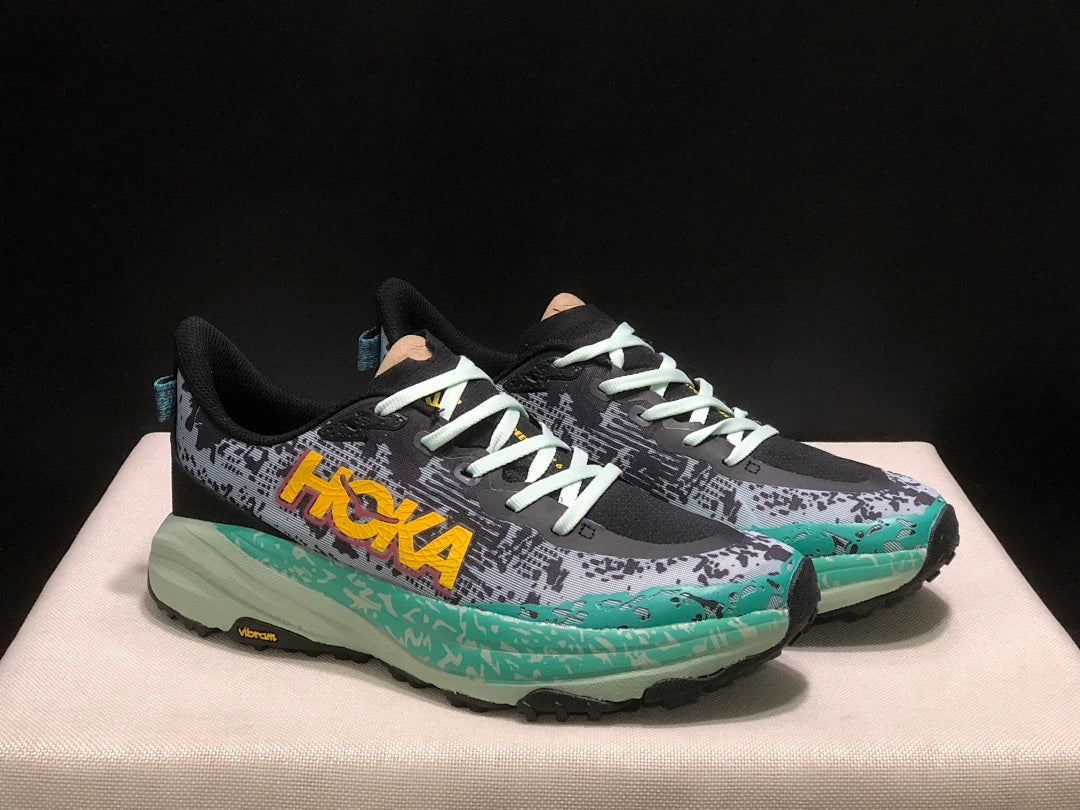 HOKA Speedgoat 6 Trail Running Shoes, in Gray and Teal - product image from the listing.