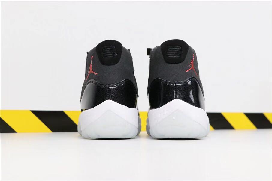 Air Jordan 11 Retro 72-10 High-Top Sneakers in Black and White - product image from the listing.