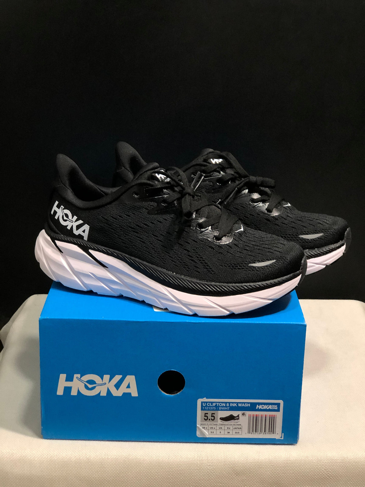 HOKA Clifton 8 Running Shoes, in Black and White - product image from the listing.