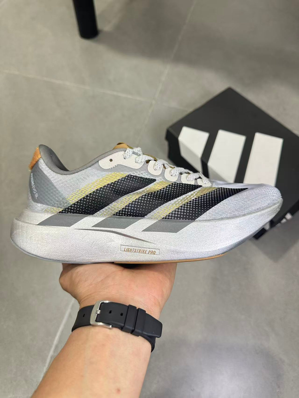 Adidas Adizero Evo SL Running Shoes in Silver Black KK4310 - product image from the listing.